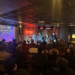 View of attendees and panel at the jaam and edge tech AI event